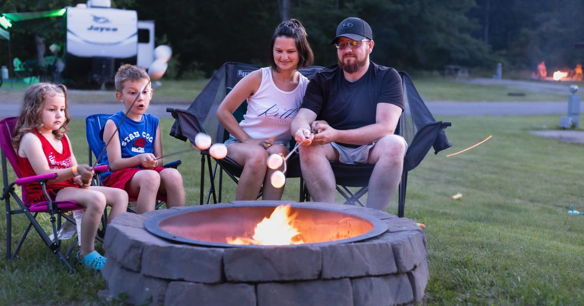 Family around campfire